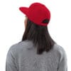 Person wearing a red cap, back view.