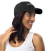 Smiling woman in black cap with "LOVE."