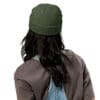Person wearing a green beanie from behind.