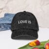 Black cap with "LOVE IS" text.