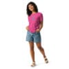 Woman in pink shirt with text design.