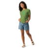 Smiling woman wearing a green t-shirt.