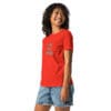 Woman smiling in red t-shirt with text.