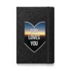 Black notebook with "God Loves You" design.