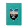 Teal notebook with "God Loves You" design.